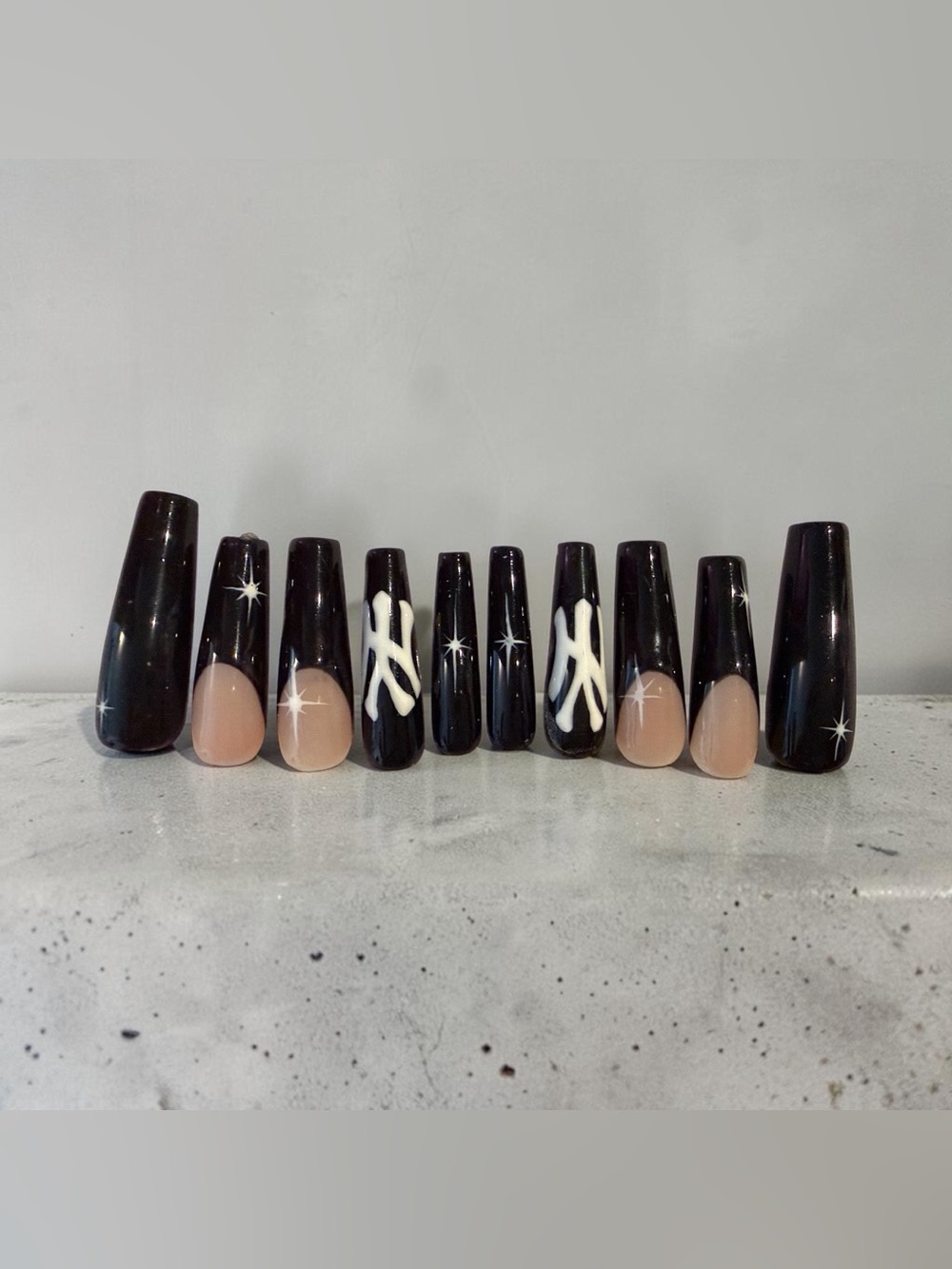 Handmade Black and Nude Press-On Nails with White Accent Design